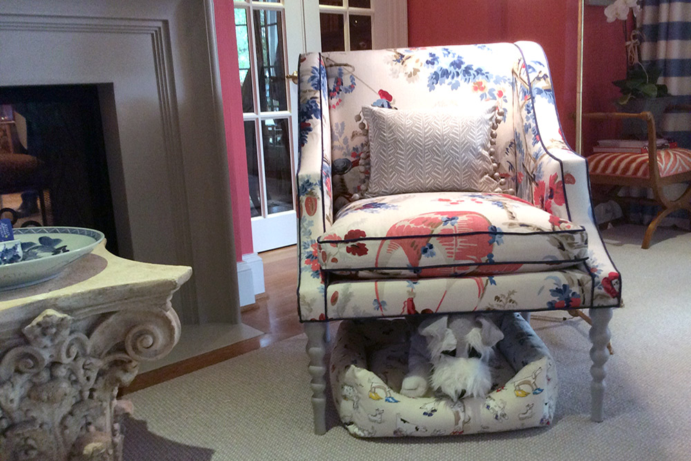 Wally from Wal-mart hides under a beautifully upholstered chair in designer Kelley Proxmire's DC Design House sitting room. / MyLittleBird photo.