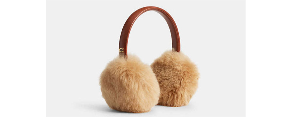 Coach ear muffs in shearling.