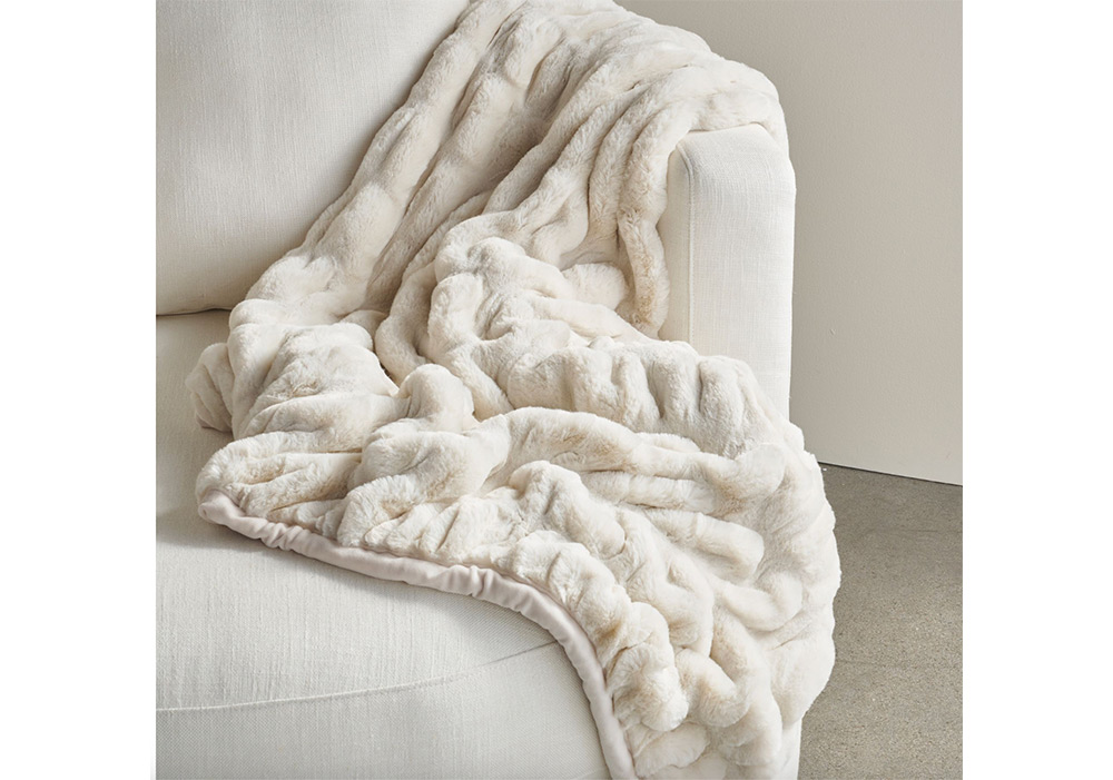 A ruched faux-fur throw from Pottery Barn. 